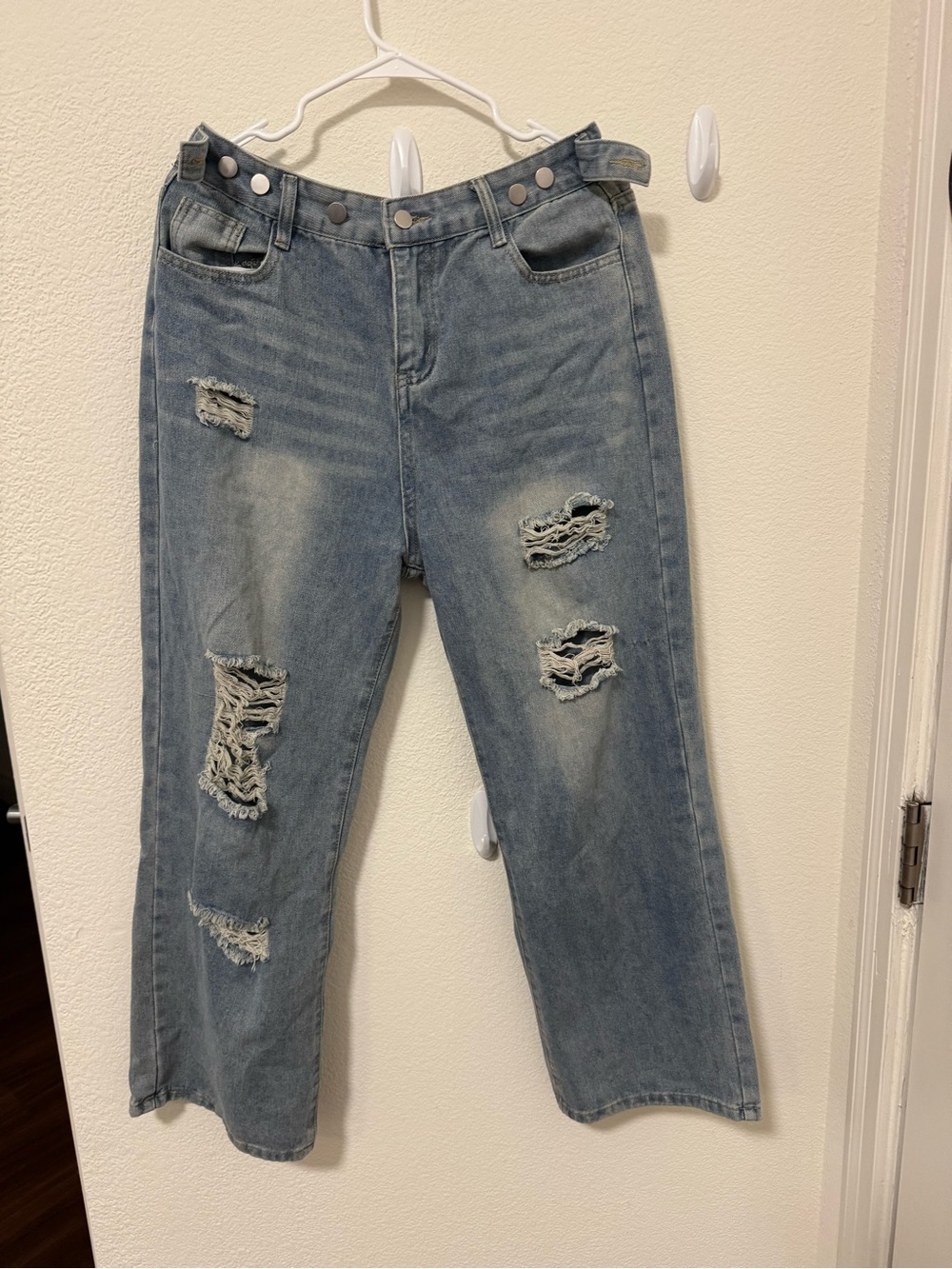 Distressed button detail zip fly jeans